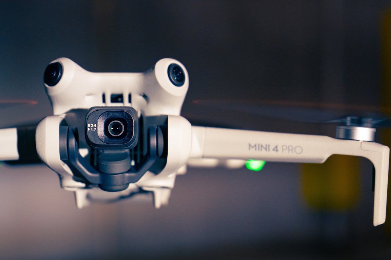 gallery-3 Detailed view of a Mini 4 Pro drone showcasing its technology and design.